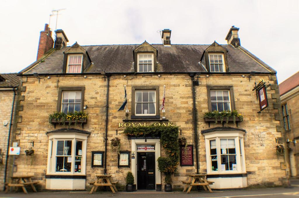 an old building in the middle of a street at The Royal Oak Hotel in Helmsley