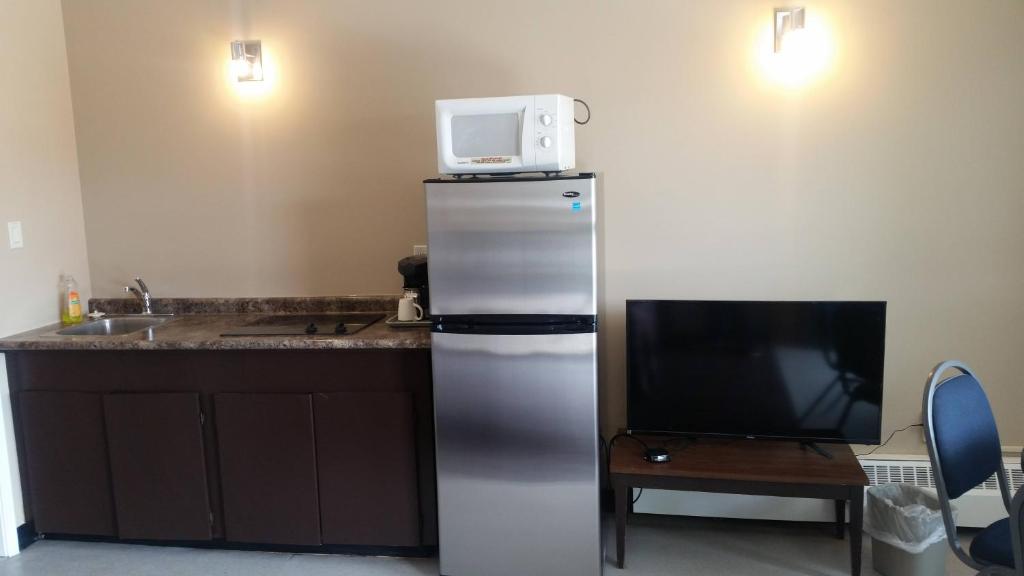 Kuchyň nebo kuchyňský kout v ubytování Alaskan Motel