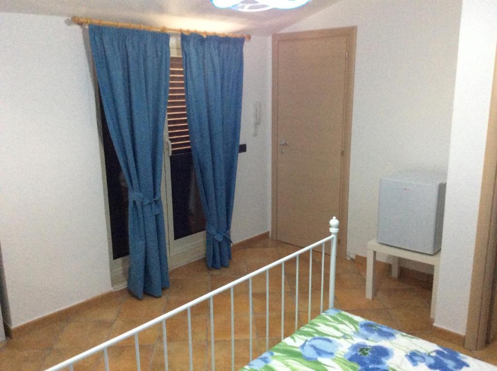 Letto o letti in una camera di B&B in Residence "...a due passi dalla Scala dei Turchi"