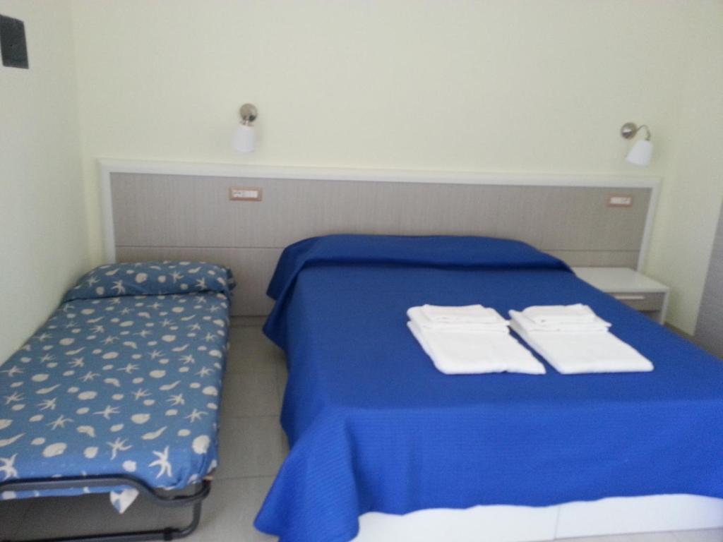 Postel nebo postele na pokoji v ubytování Il Girasole Formia Guesthouse rooms