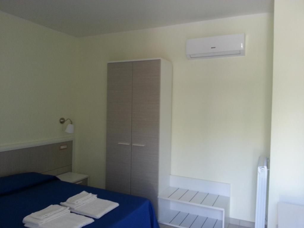 Postel nebo postele na pokoji v ubytování Il Girasole Formia Guesthouse rooms