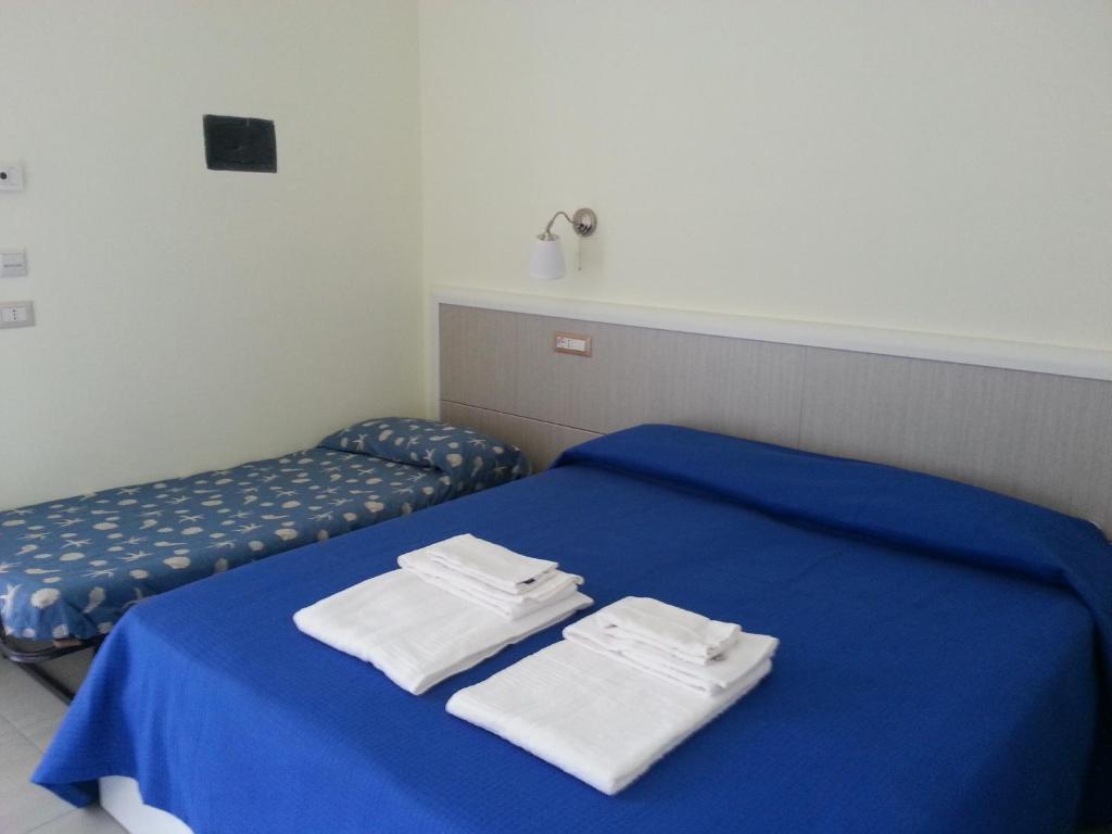 Postel nebo postele na pokoji v ubytování Il Girasole Formia Guesthouse rooms