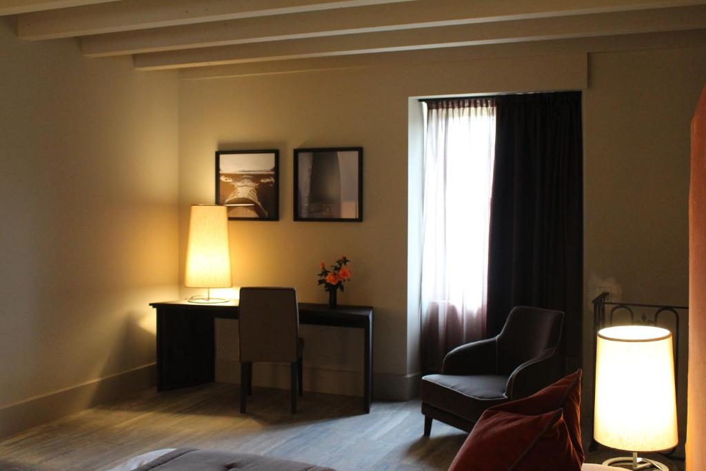 Posezení v ubytování Podere Castel Merlo Resort
