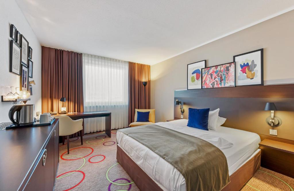 Giường trong phòng chung tại Leonardo Hotel Hannover Medical Park