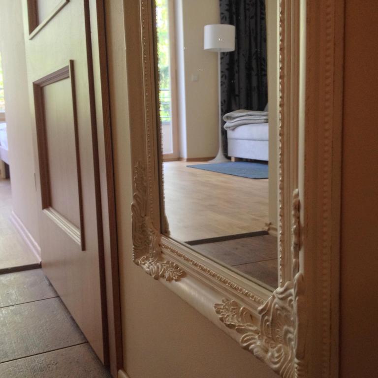 a mirror on a door in a room at Fortuuna 5 Apartment in Tartu