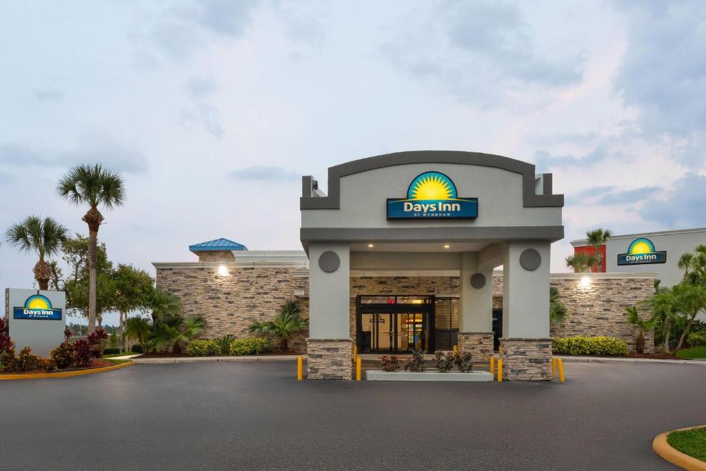 a rendering of the front of a hotel at Days Inn by Wyndham Orlando Conv. Center/International Dr in Orlando