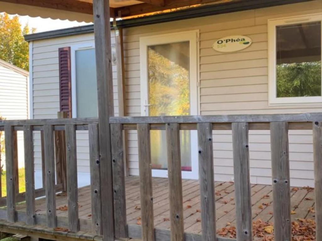 a front porch of a house with a deck at Mobil-home 4 Pers avec Terrasse à Limeuil - API-1-52-553 in Limeuil