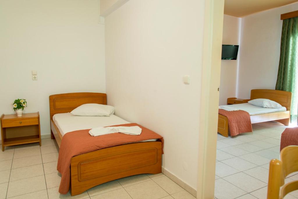 Postel nebo postele na pokoji v ubytování Agrellis Apartments