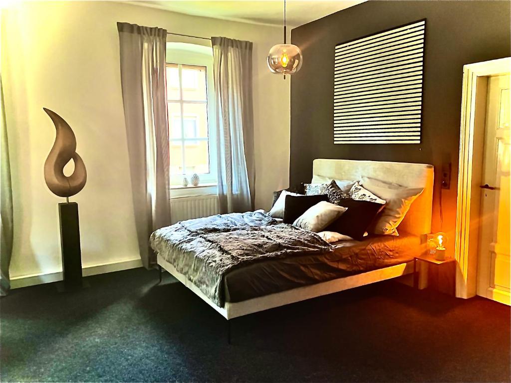 a bedroom with a bed and a window at Adlershof in Hemmersheim