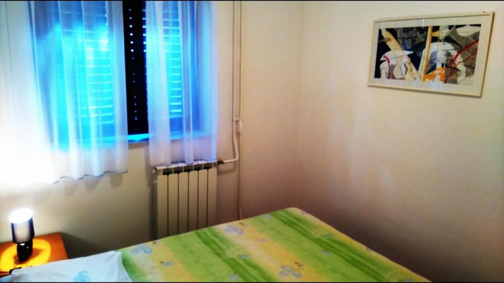 Posteľ alebo postele v izbe v ubytovaní Apartments Kalac