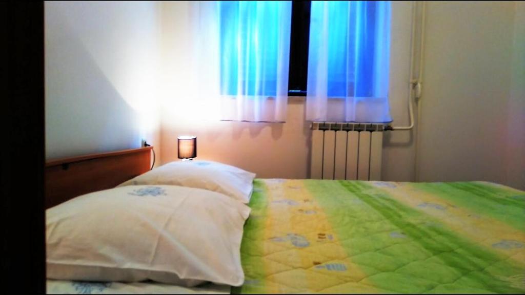 Posteľ alebo postele v izbe v ubytovaní Apartments Kalac