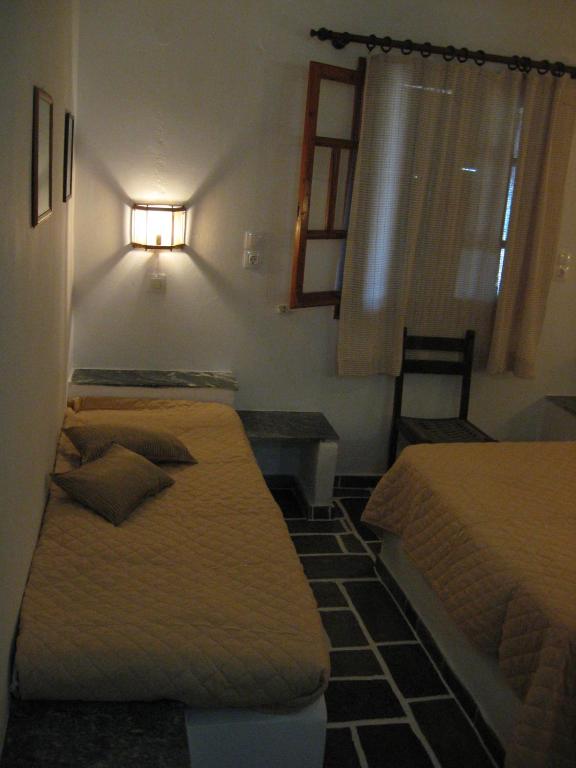 Postel nebo postele na pokoji v ubytování Pension Irini-Vicky