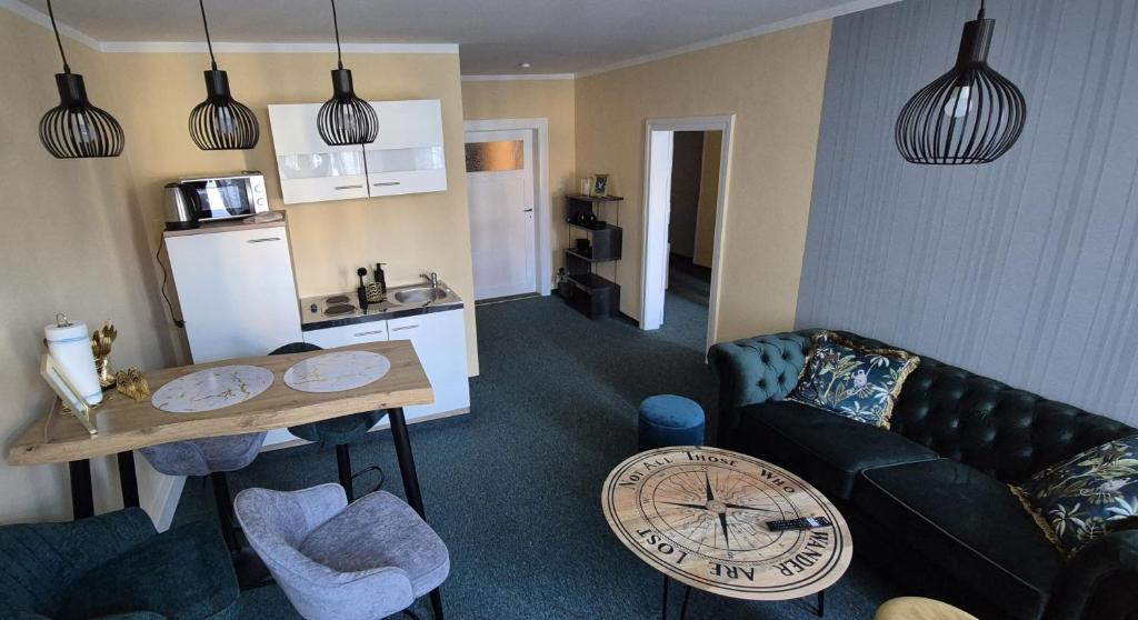 a living room with a couch and a table at Ferienwohnung zum Türmer in Görlitz
