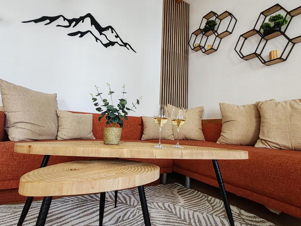 a living room with a couch and a table at Apartmán EveRest Donovaly in Donovaly