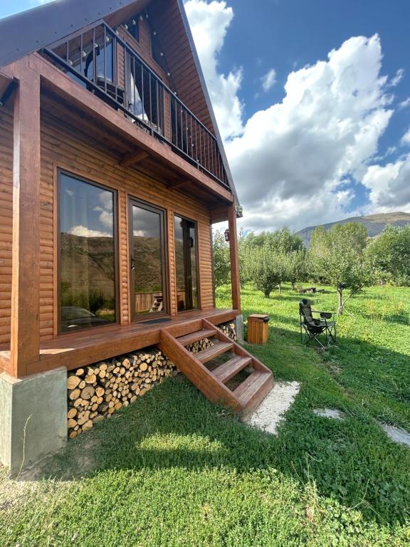 a log cabin with a porch and a deck at Address number 8 in Yeghegnadzor