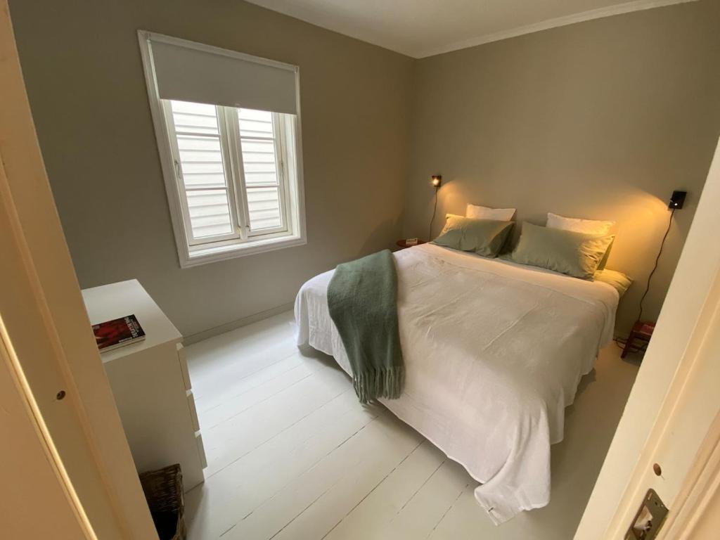 Ένα ή περισσότερα κρεβάτια σε δωμάτιο στο A cosy flat in the heart of Stavanger