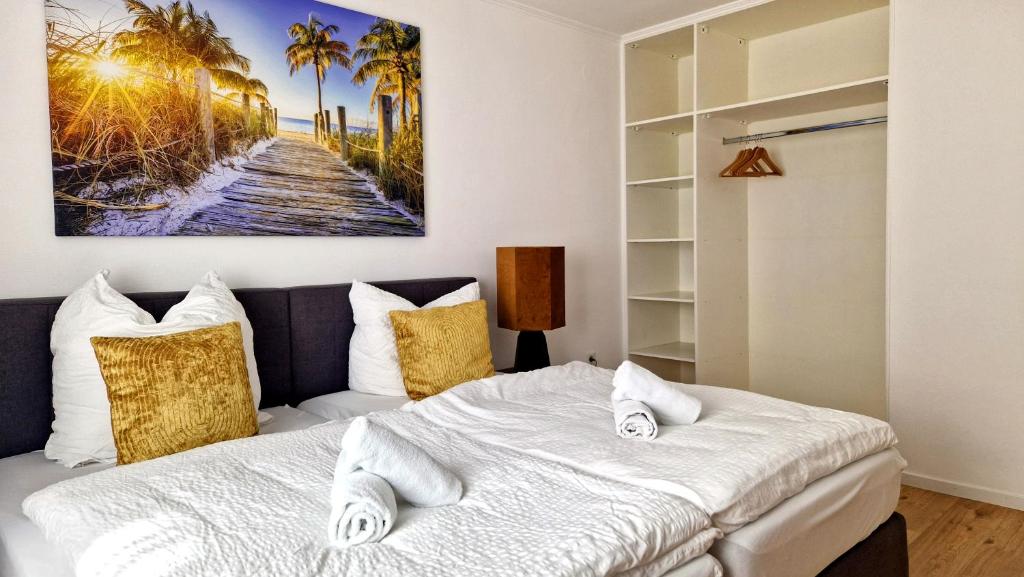 a bedroom with a bed and palm trees at ARGENTA Living 42 in Künzell