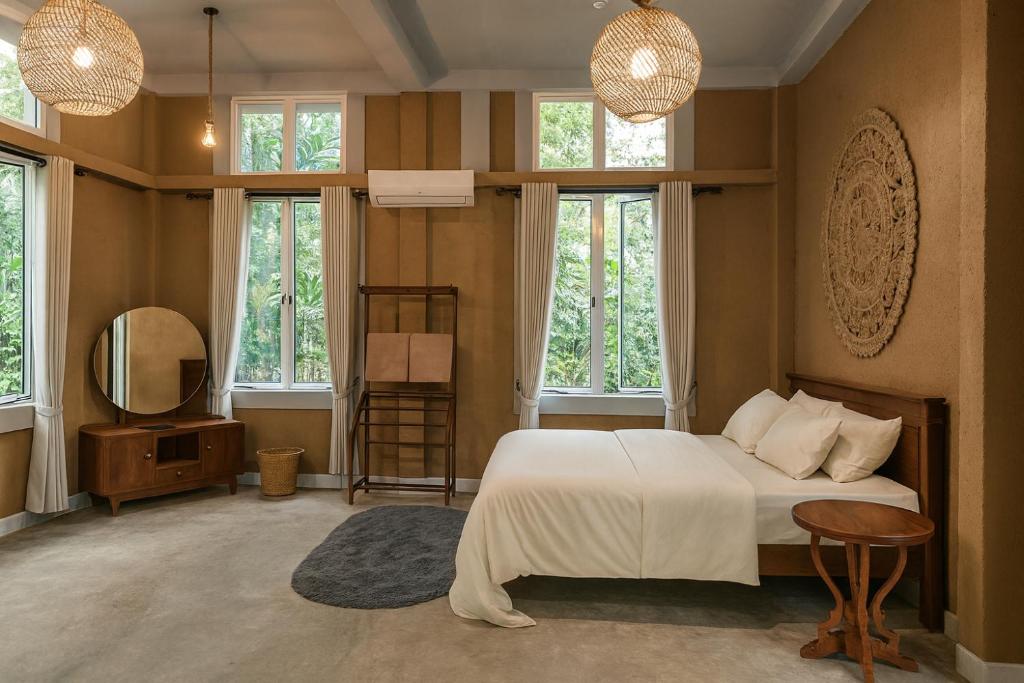 Ένα ή περισσότερα κρεβάτια σε δωμάτιο στο Nature Home near Colombo Airport