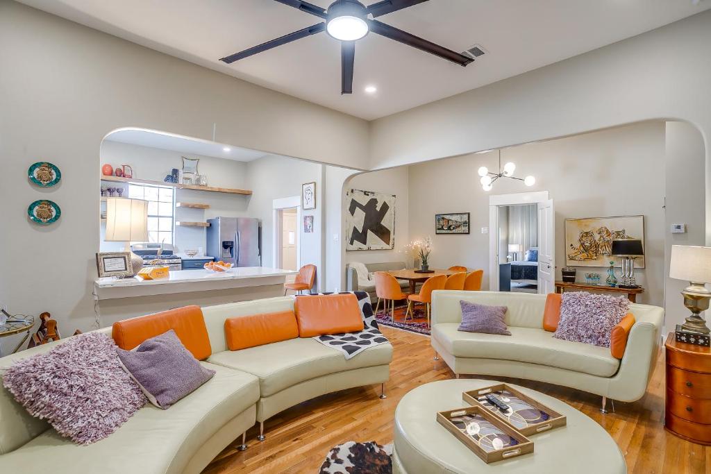a living room with two couches and a table at Stadium Luxe Retreat- Walking Distance to AT&T Sta in Arlington