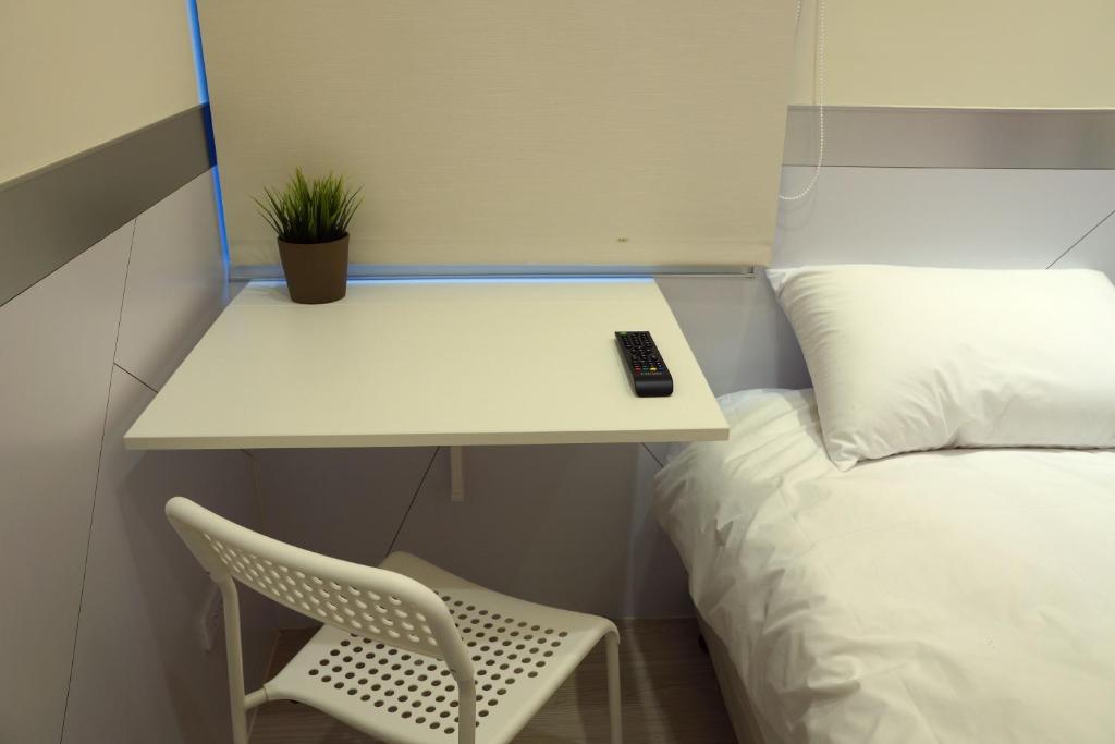 Postel nebo postele na pokoji v ubytování ColorMix Hotel & Hostel