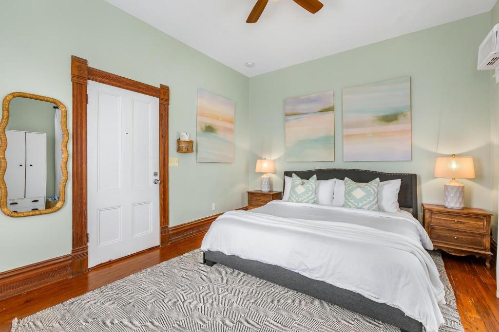a bedroom with a large bed and a mirror at CAPTIVA at Azul Mansion Key West in Key West