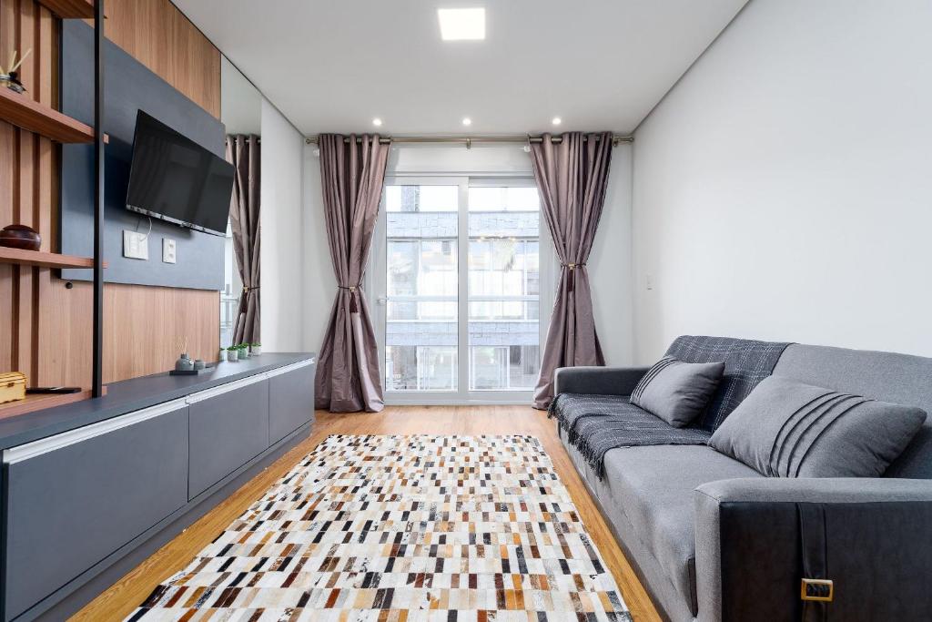 TV a/nebo společenská místnost v ubytování Residencial Vêneto 1 dorm Achei Gramado