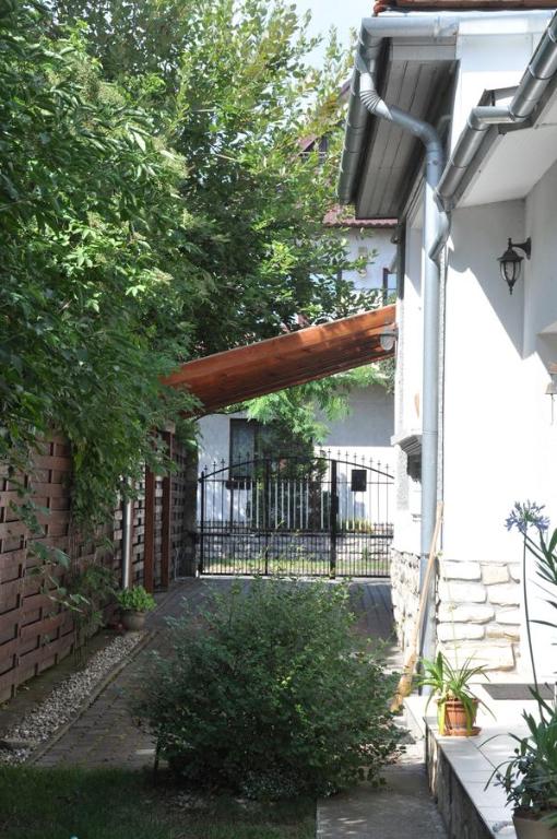 an entrance to a house with a fence and a gate at Kertes in Veszprém