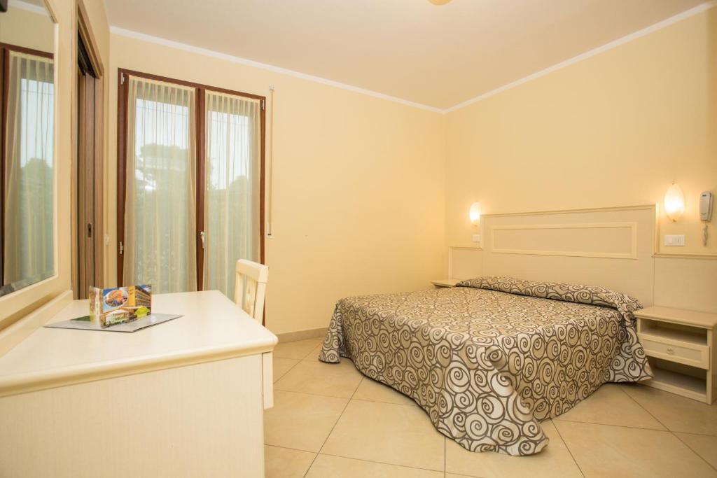Postel nebo postele na pokoji v ubytování Albergo Ristorante Pozzi