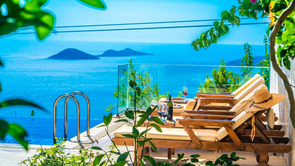 a patio with a view of the ocean at Eco Villa BEGONVİL in Kalkan