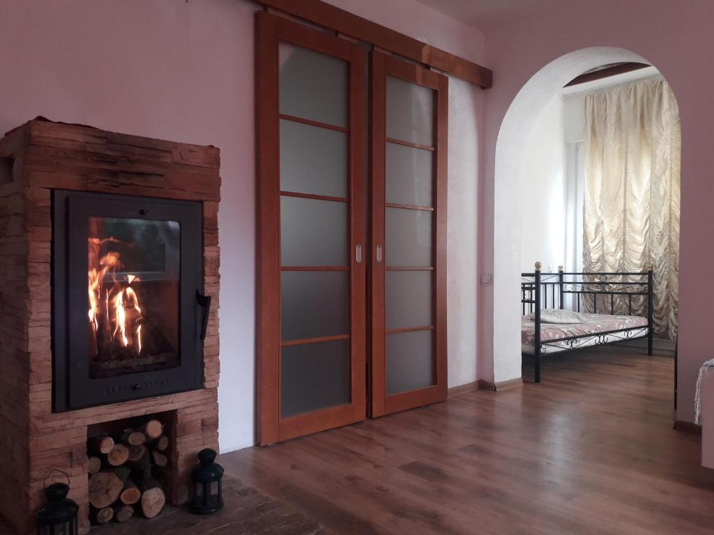 a fireplace in a living room with a fire place at Apartment Magnolija in Jūrmala
