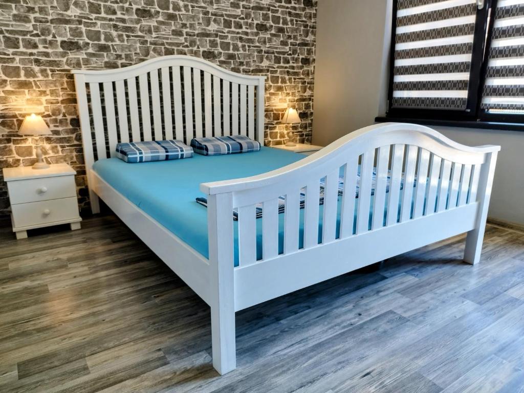 Postel nebo postele na pokoji v ubytování Aпартамент 5