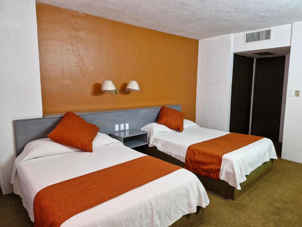 Katil atau katil-katil dalam bilik di Parador del Río Irapuato