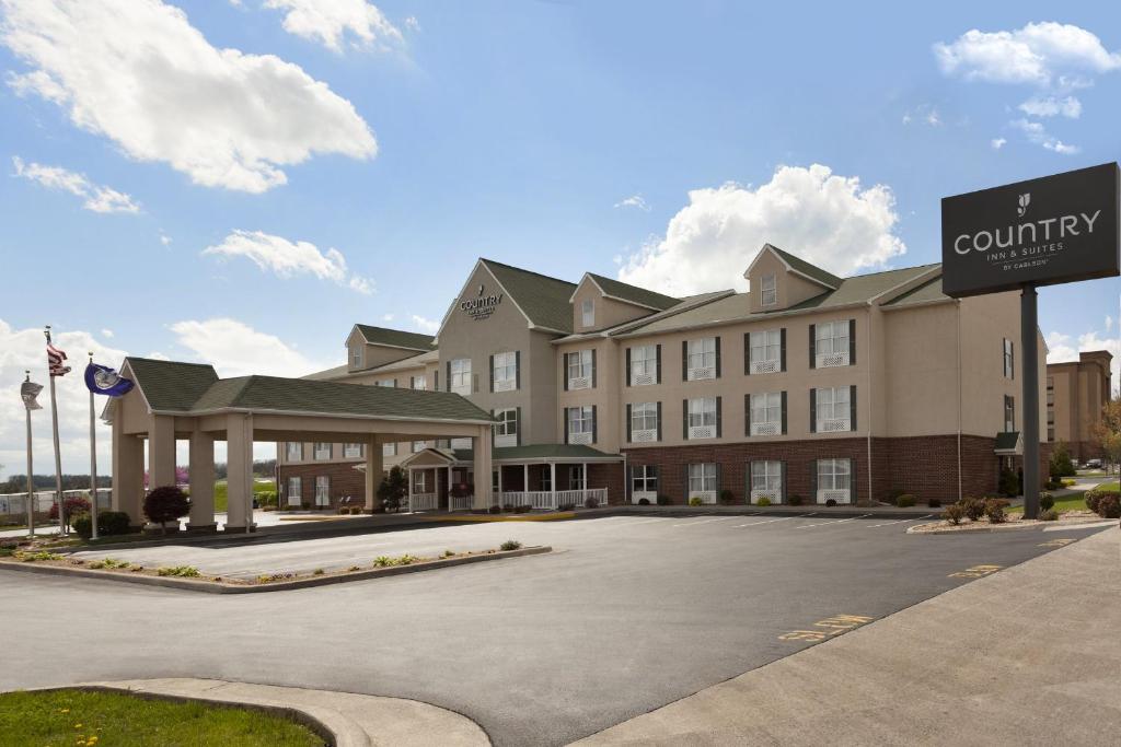 a large building with a sign in front of it at Country Inn & Suites by Radisson, Harrisonburg, VA in Harrisonburg