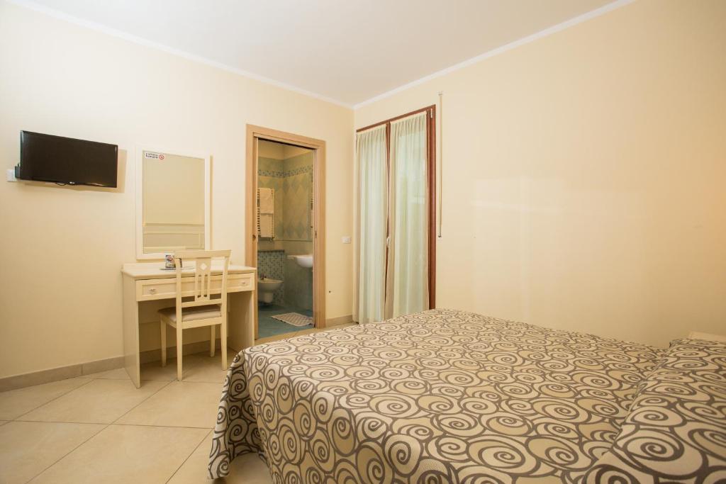Postel nebo postele na pokoji v ubytování Albergo Ristorante Pozzi