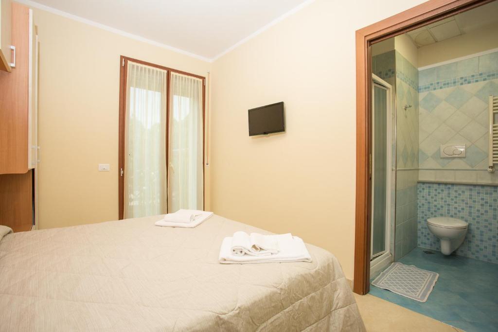 Postel nebo postele na pokoji v ubytování Albergo Ristorante Pozzi