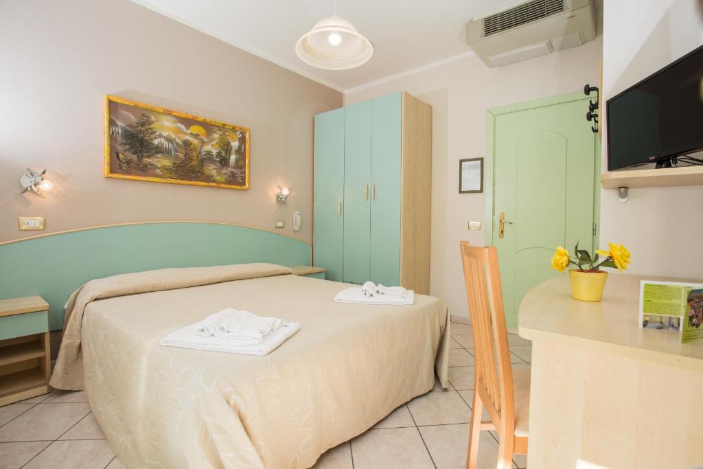 Postel nebo postele na pokoji v ubytování Albergo Ristorante Pozzi