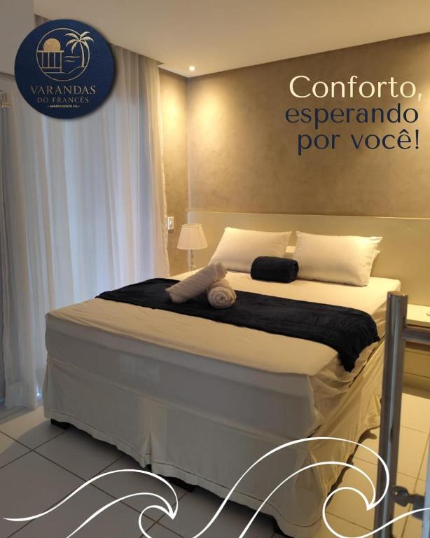 a bedroom with a bed with a sign on the wall at varandasdofrancesapt216 Praia do Frances in Praia do Frances