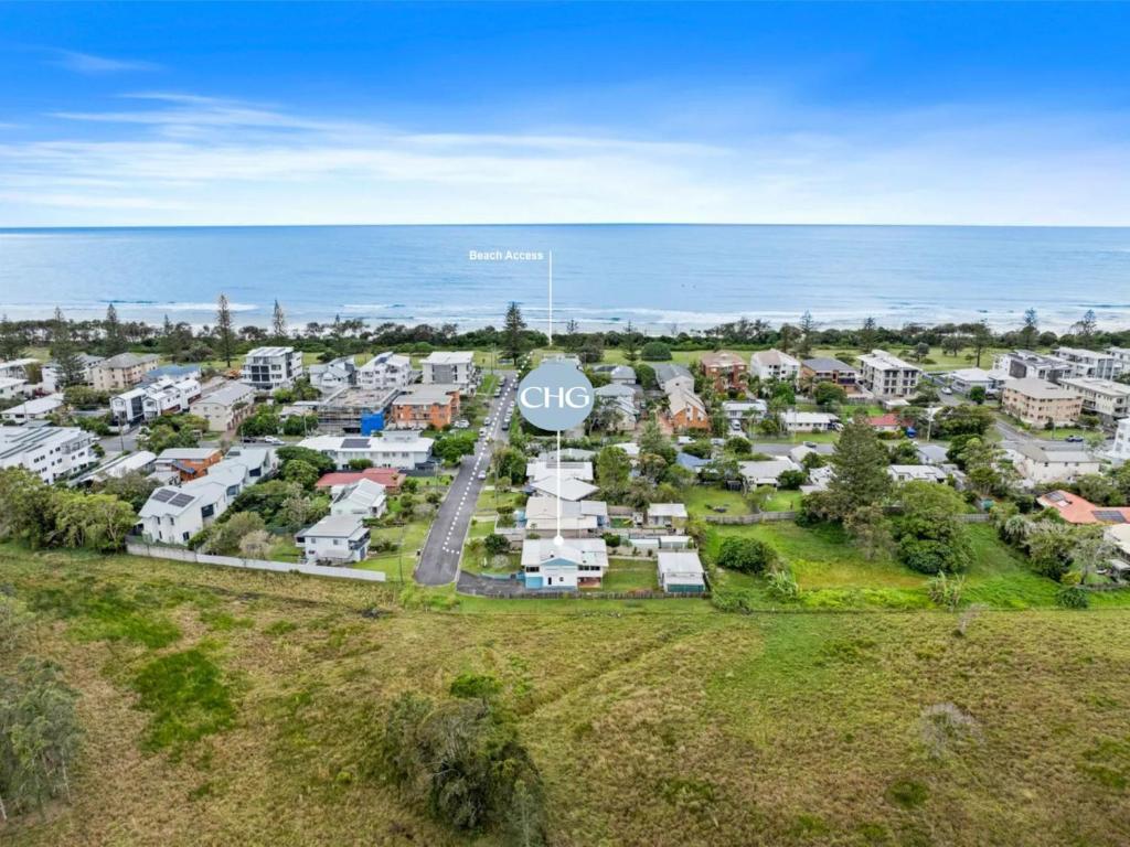 an aerial view of an apartment complex next to the ocean at Pacific Waves - Pet Friendly Original Beach House in Kingscliff