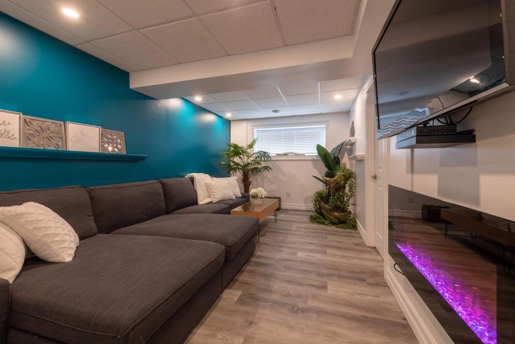 a living room with a couch and blue walls at Magical Themed Decor! Pets Welcome! 3 Bedrooms in Chase