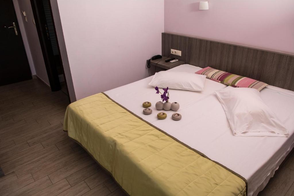 Postel nebo postele na pokoji v ubytování Hotel Olympos