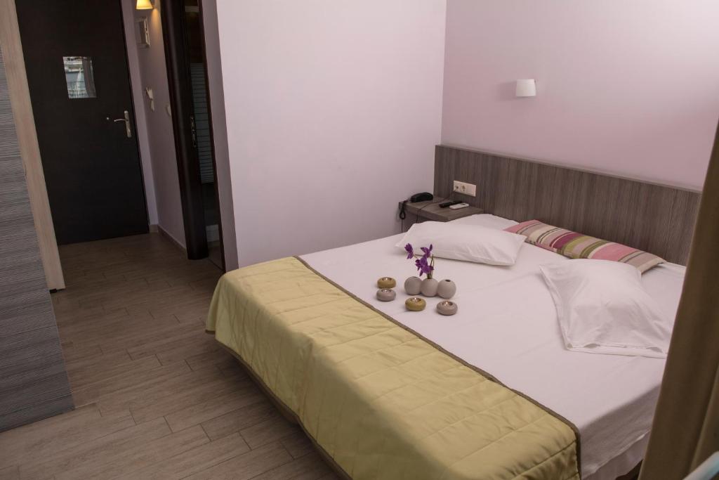 Postel nebo postele na pokoji v ubytování Hotel Olympos