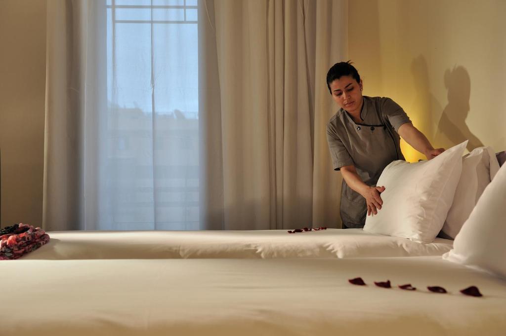 Postel nebo postele na pokoji v ubytování Novotel Marrakech Hivernage