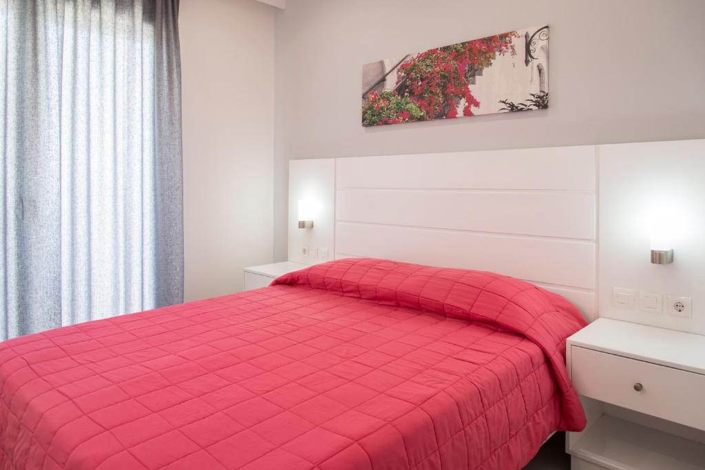 Postel nebo postele na pokoji v ubytování Byron Apartments