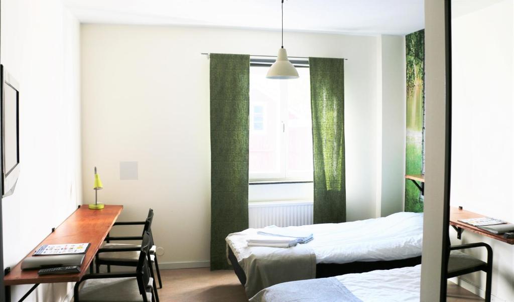 Postel nebo postele na pokoji v ubytování Svefi Vandrarhem - Hostel