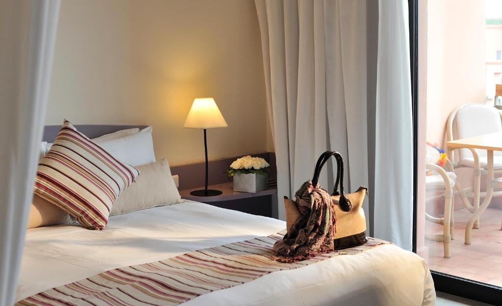 Postel nebo postele na pokoji v ubytování Novotel Marrakech Hivernage