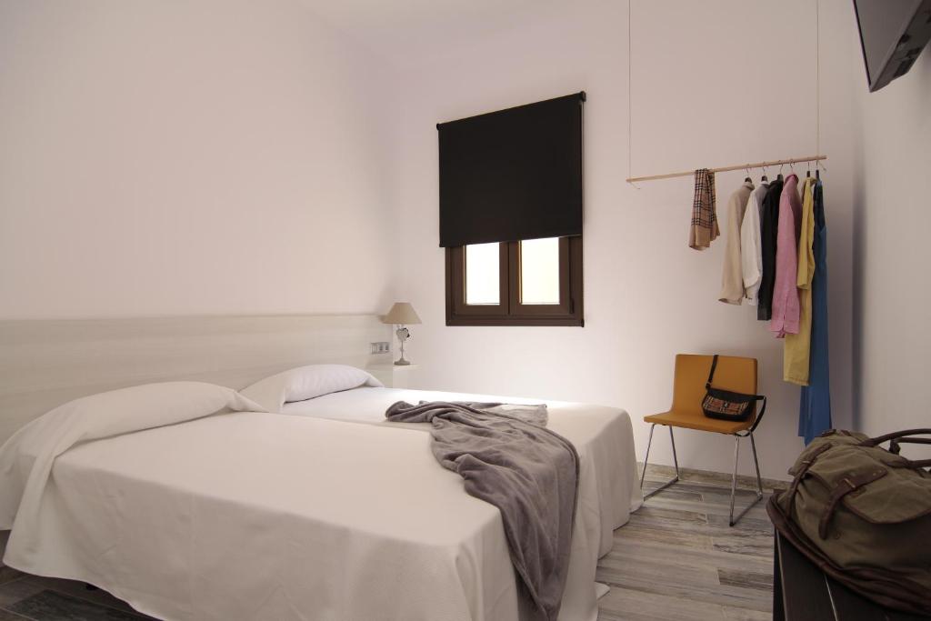 Posteľ alebo postele v izbe v ubytovaní The 8 Rooms House
