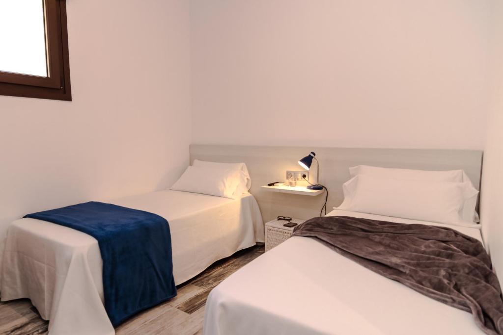 Posteľ alebo postele v izbe v ubytovaní The 8 Rooms House