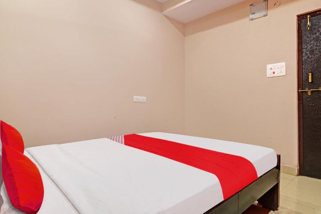 Ένα ή περισσότερα κρεβάτια σε δωμάτιο στο Hotel O Vasista Residency