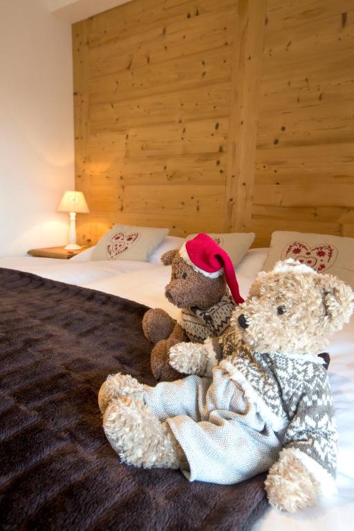 Letto o letti in una camera di Hôtel de charme la Poste