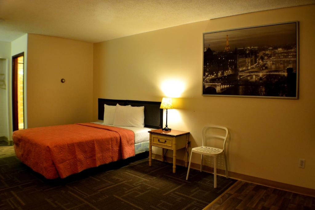 Postel nebo postele na pokoji v ubytování Hoo-Doo Motel